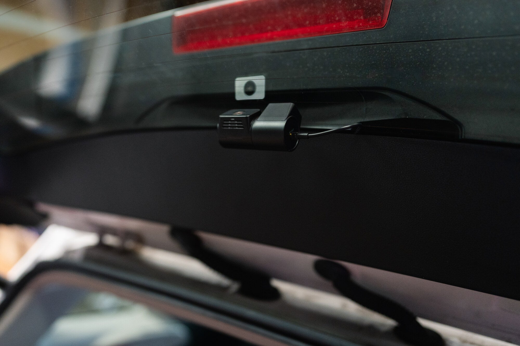 Front dash cam installed behind the mirror