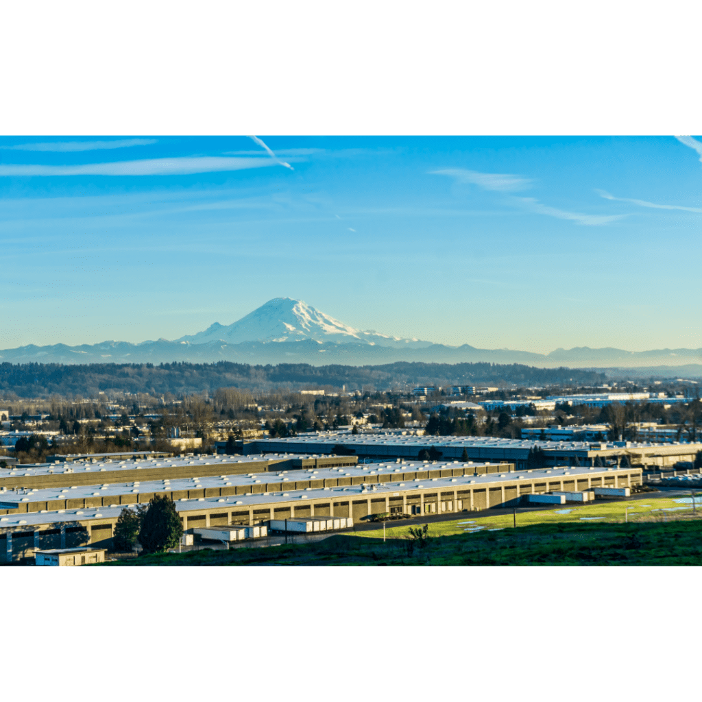 View of Mount Rainier over an industrial area in Tukwila, Washington.